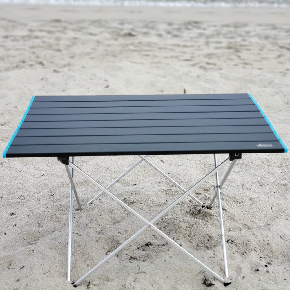 Docktails lightweight, foldable and compact beach or camp table. This table weighs less than four pounds and is equally perfect for your beach or mountain adventures. Photo taken in Delray Beach Florida.