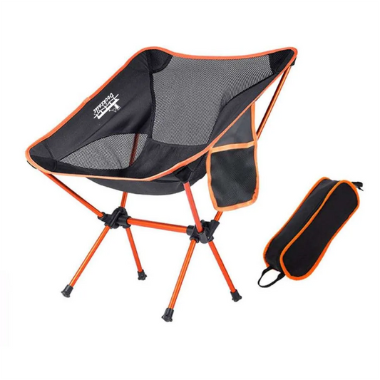 A black and orange folding camp chair with a mesh backrest and side pocket, shown alongside its matching black and orange carrying bag on a white background.