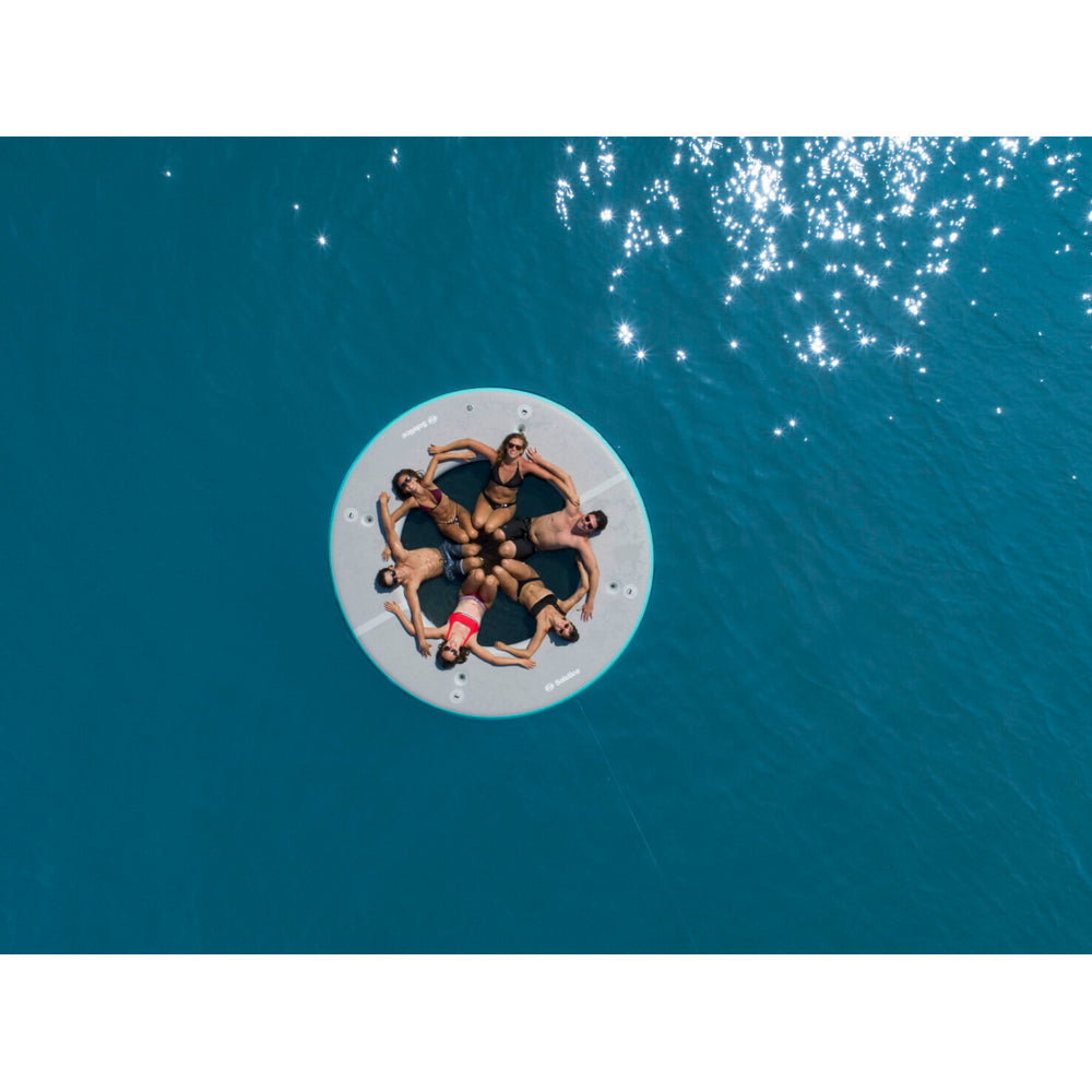 Solstice inflatable circular mesh dock aerial picture with 6 people enjoying the dock
