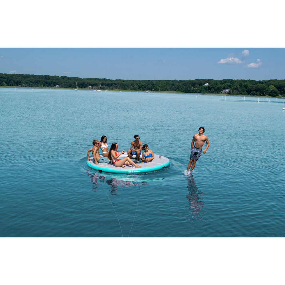 Solstice inflatable circular mesh dock with people enjoying the dock