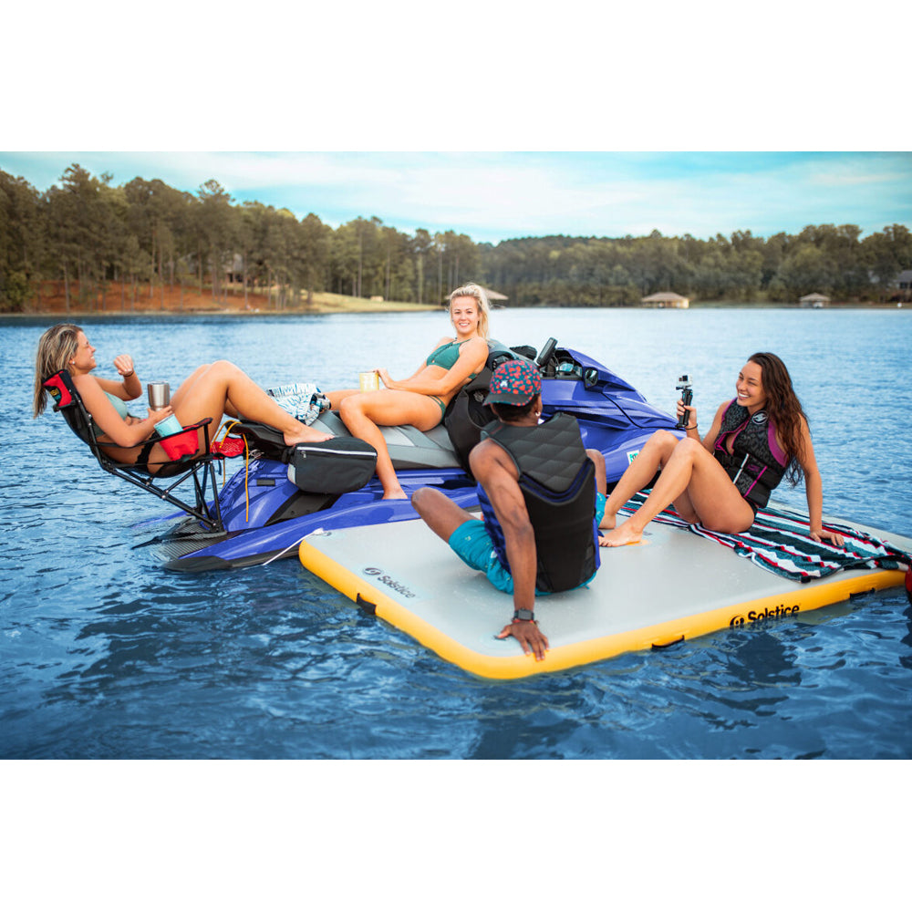 Solstice inflatable dock with jet ski dock and people relaxing