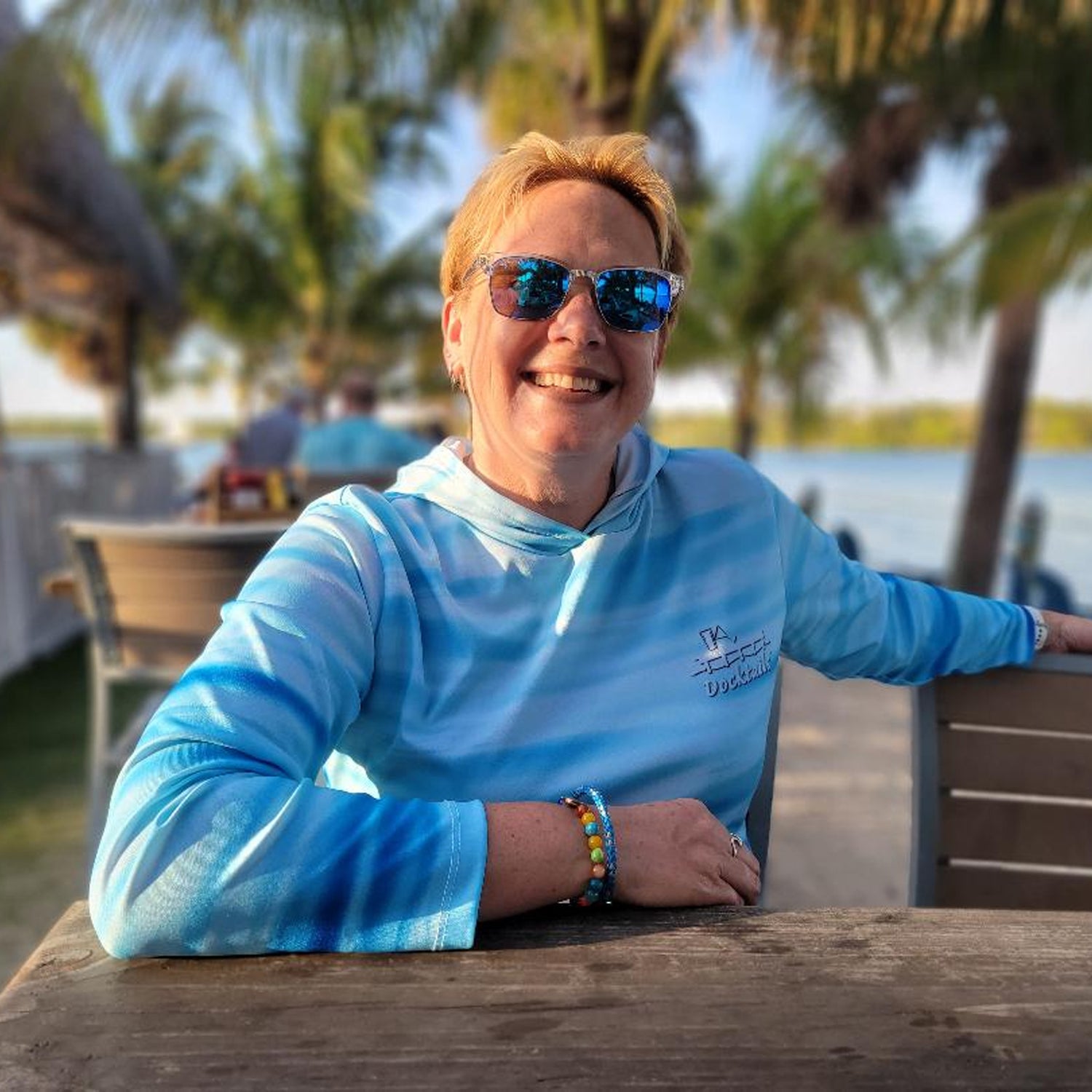 Docktails Ocean Vibes Sun Shirt Hoodie at Beach Bar in Jupiter Florida