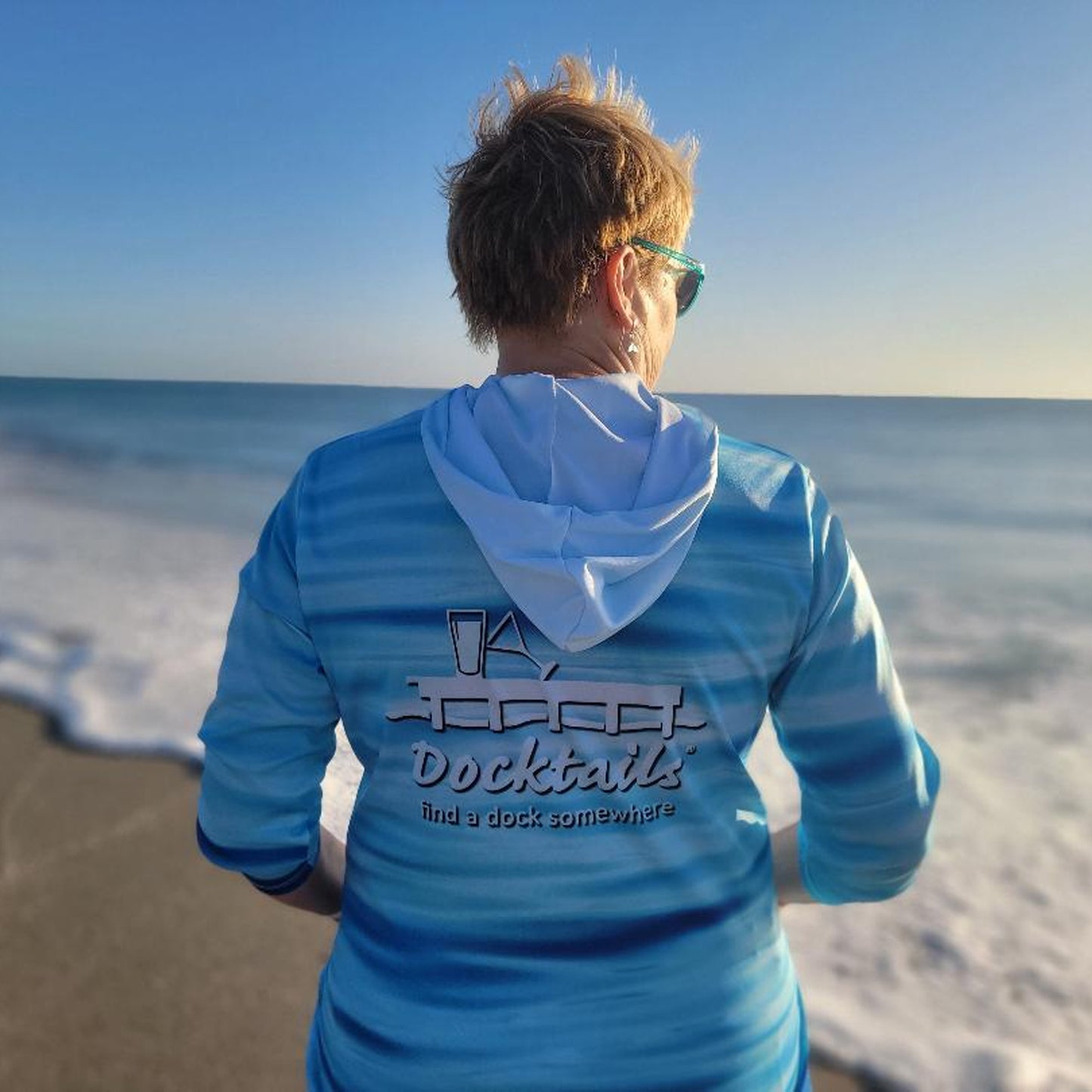 Docktails Ocean Vibes Sun Shirt Hoodie at Hobe Sound Beach in Florida