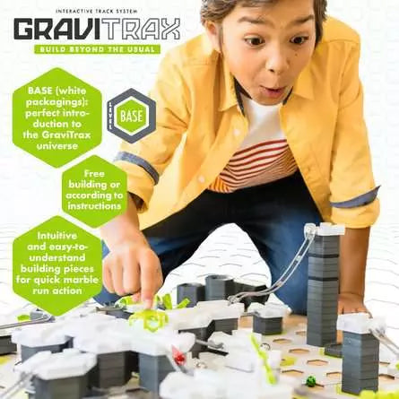 Child playing with GraviTrax Starter Set Marble Track Building System