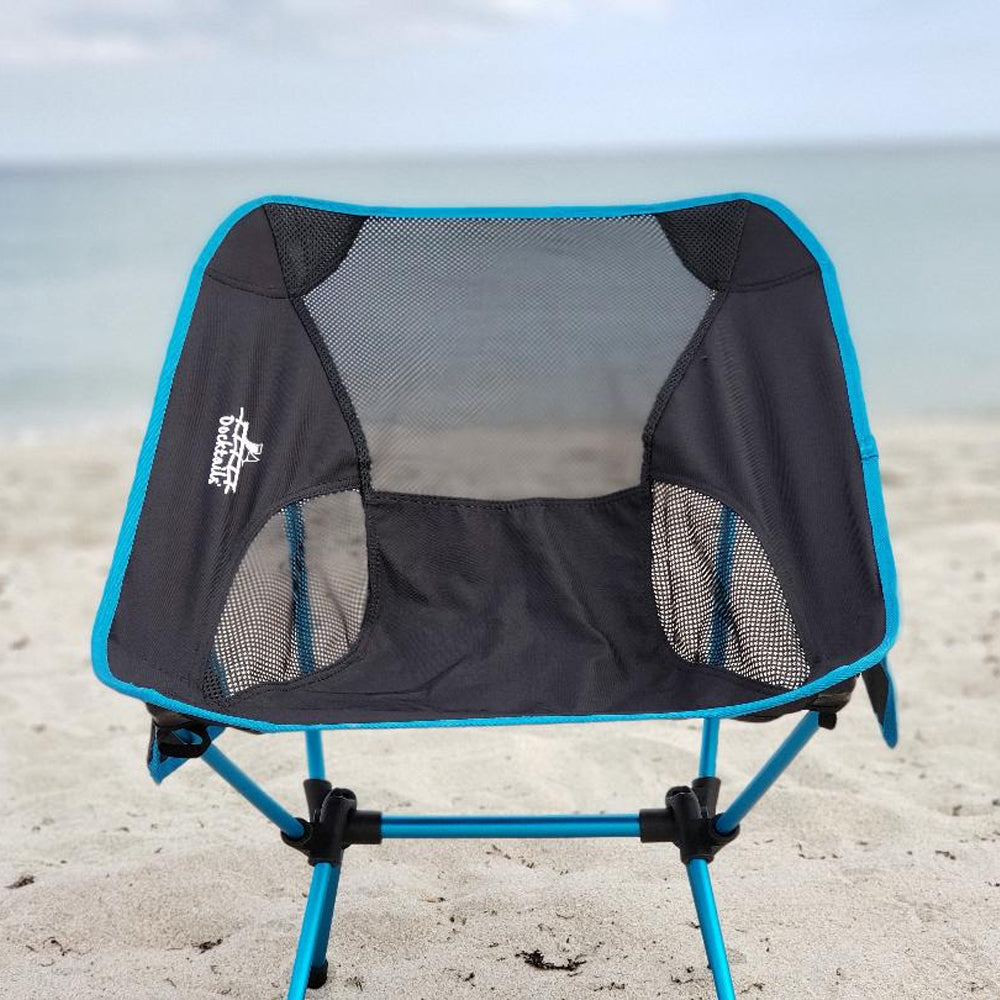 Docktails camp chair is equally comfortable in the mountains or on the beach. Weighing less than two pounds, the chair is very compact and easily travels in beach bags or backpacks. Picture taken in Delray Beach Florida.