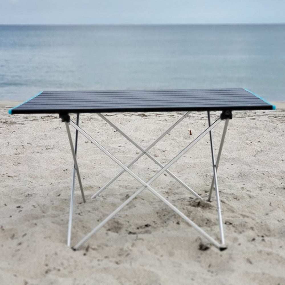 Docktails foldable, lightweight and compact beach or camp table. This table weighs less than four pounds and is equally perfect for your beach or mountain adventures. Picture taken in Delray Beach Florida.