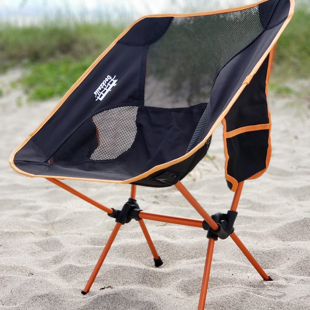 Docktails compact and lightweight camp chair, perfect for beach or mountains. Weighs less than two pounds. Photo taken in Delray Beach Florida.