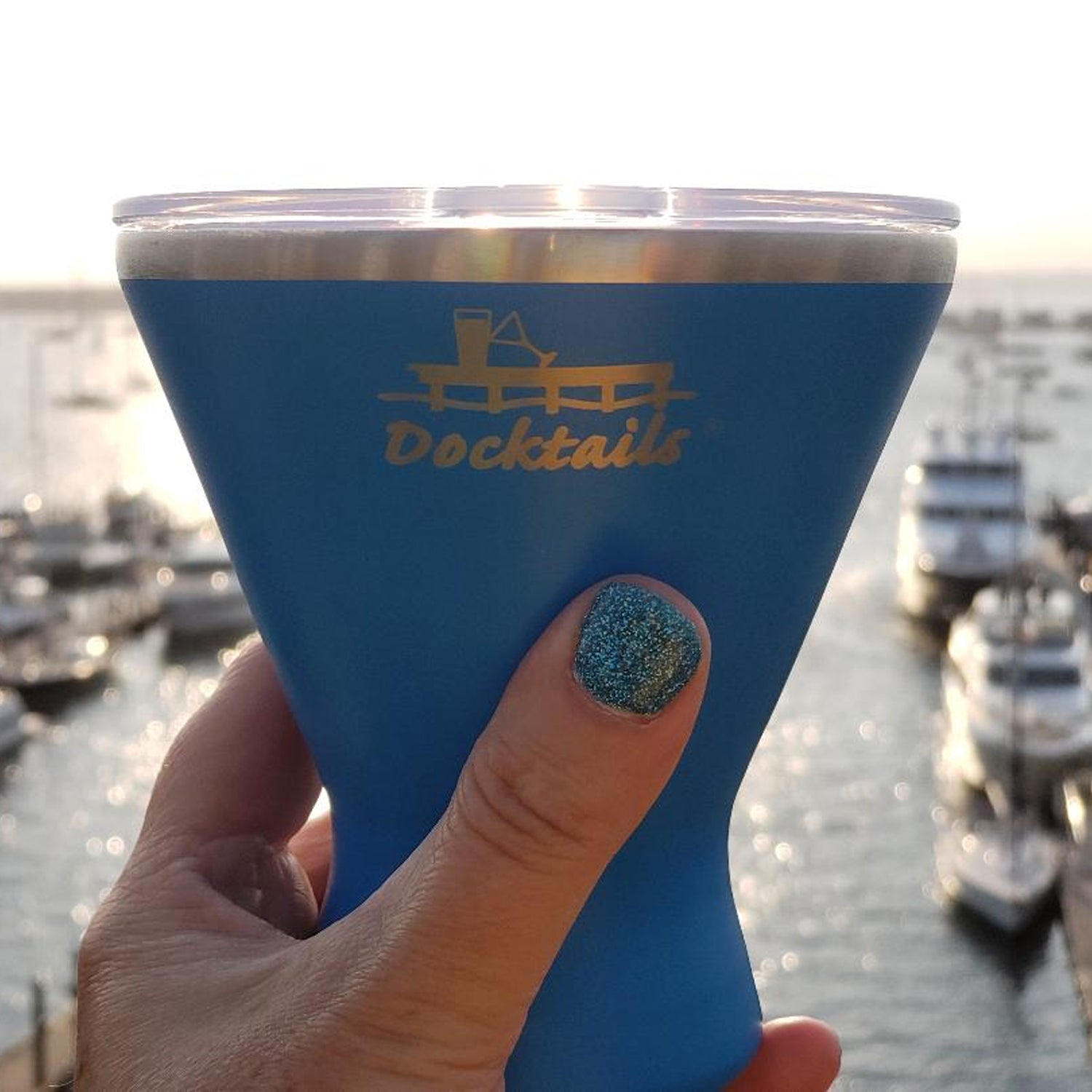 Docktails insulated stemless martini cup in use at a waterfront deck