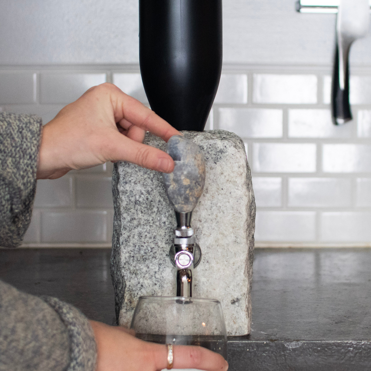 Stone drink dispenser in use